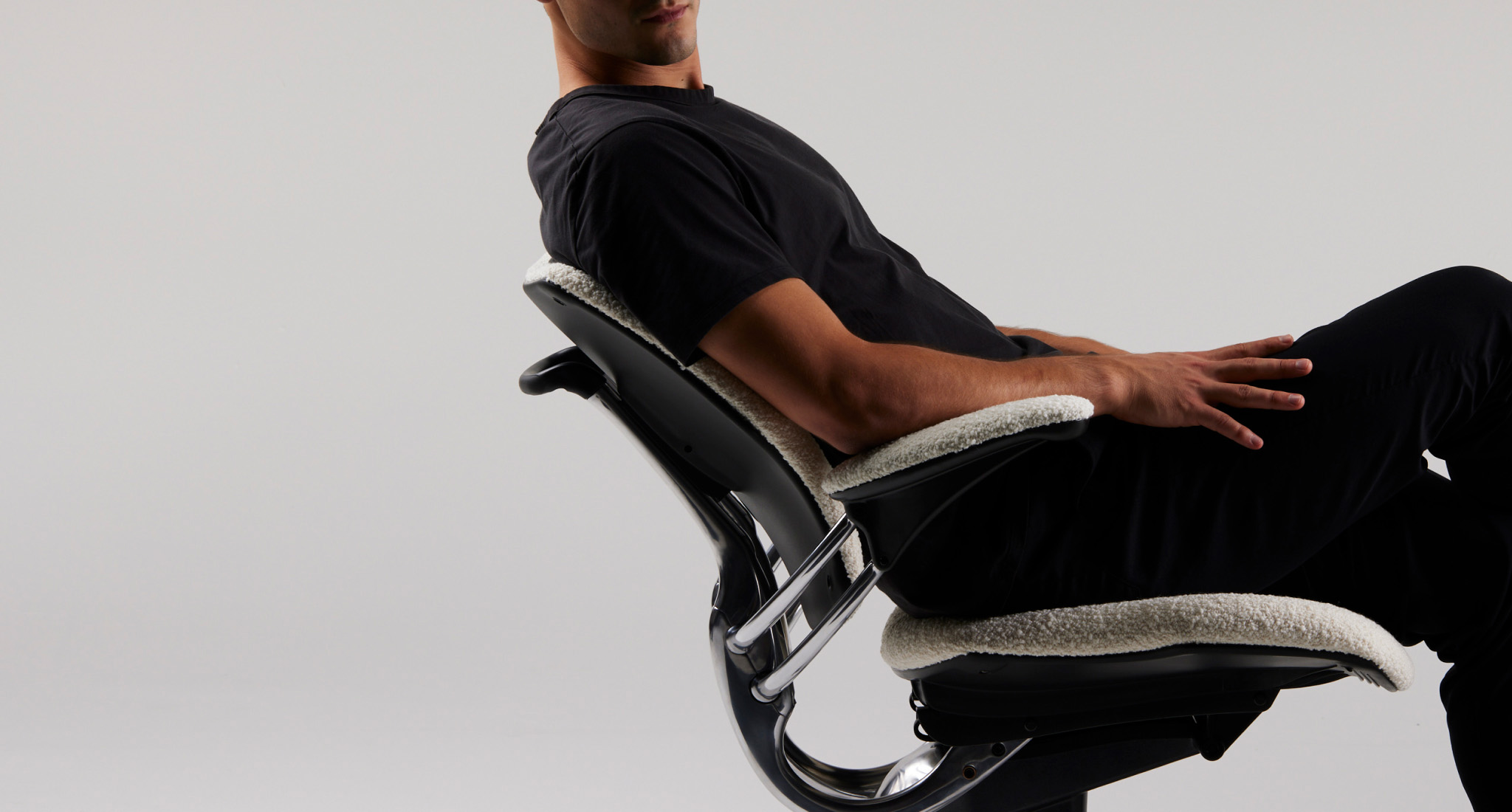 Person leaning back in a Freedom Task chair