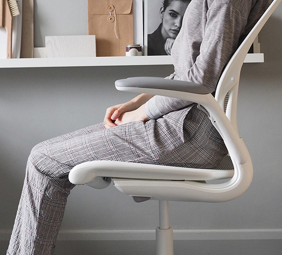 Space Designed by Cate St Hill, Person reclining on World Chair